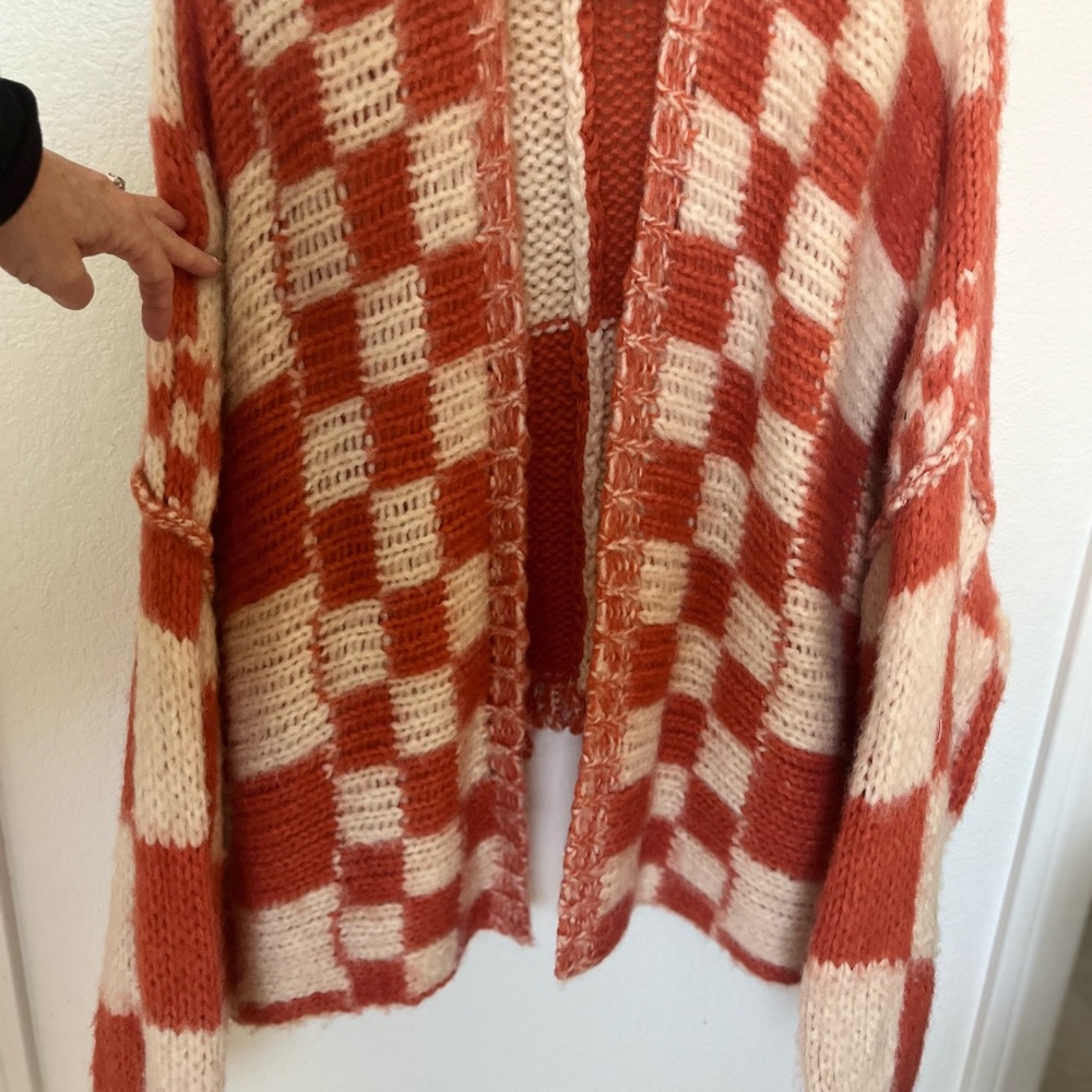 Free people sweater/ over sized. Orange and cream. Size xs/s